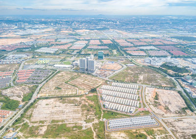 Aerial view of cityscape against sky