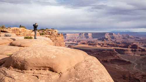 Man standing on rock formations