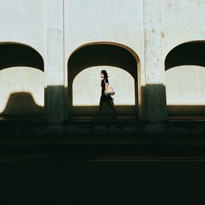 Low angle view of silhouette man standing against clear sky