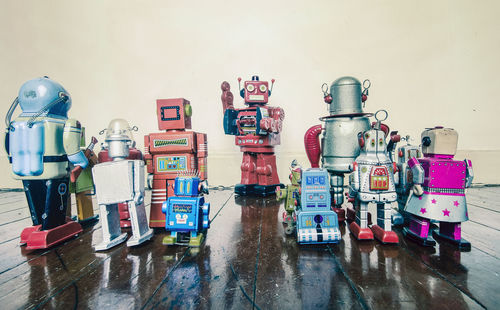 Multi colored toy on table against wall