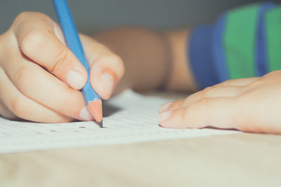 Close-up of hand holding book
