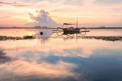 Scenic view of sea against sky at sunset