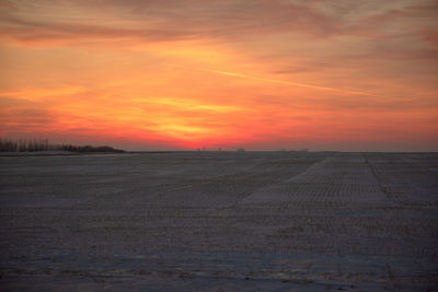 Scenic view of sunset over land