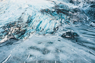 Aerial drone top view glacier iceland, melting ice, climate change and global warming concept