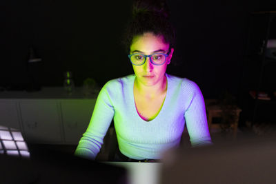 Freelance worker with eyeglasses working at home office