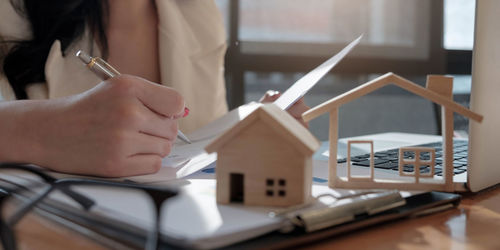 Midsection of woman working on table