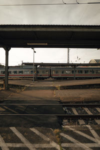 Train at railroad station against sky