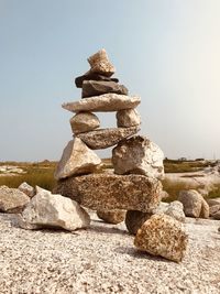 Stack of stones against clear sky