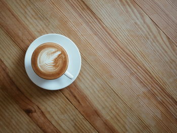 High angle view of cappuccino on table