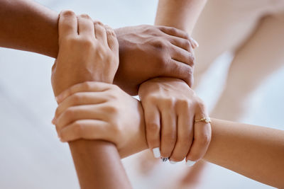 Cropped image of couple holding hands