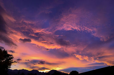 Low angle view of dramatic sky during sunset