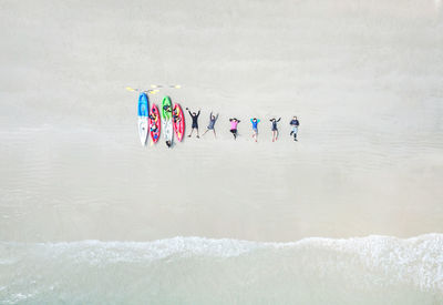 Aerial view people lying down on beach