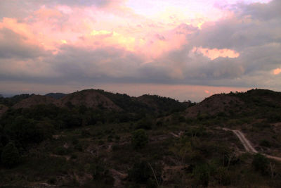 Scenic view of mountains against dramatic sky