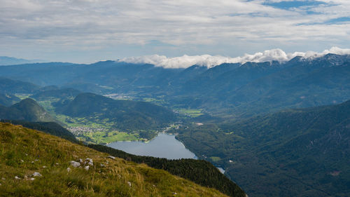 Scenic view of valley and mountains against sky