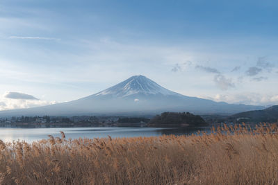 Scenic view of lake and mountains against sky