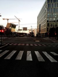 View of city street and buildings against sky