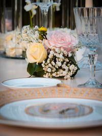 Close-up of roses in vase on table