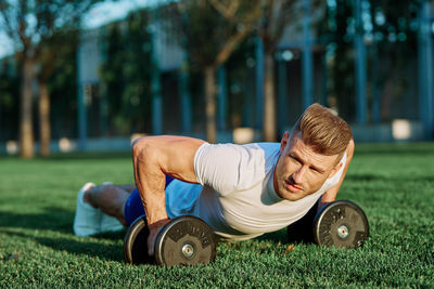 Portrait of woman exercising in park