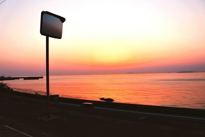 Scenic view of sea against clear sky during sunset
