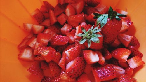 Chopped strawberries in container