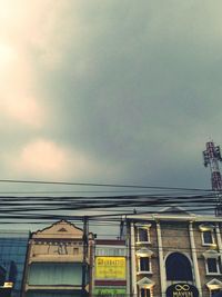 Low angle view of building against cloudy sky