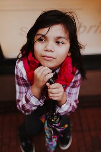 Portrait of happy girl standing at home