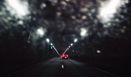Cars in illuminated tunnel