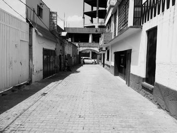 Street by buildings in city