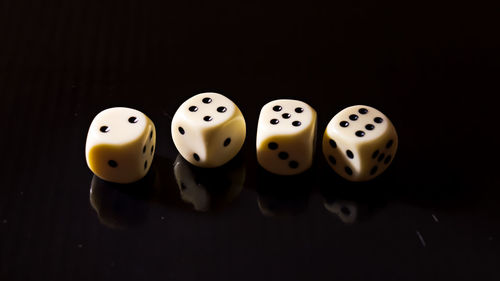 High angle view of coins on table against black background