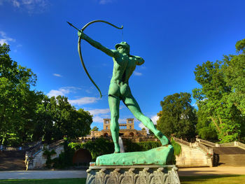 Statue against blue sky