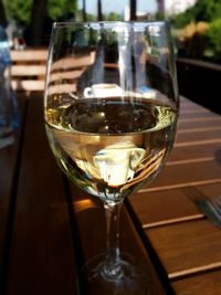 Close-up of wine glasses on table