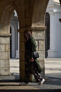 Rear view of woman walking in building