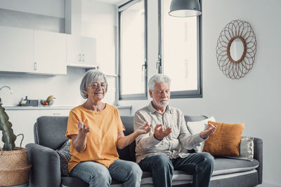 Portrait of senior man sitting at home