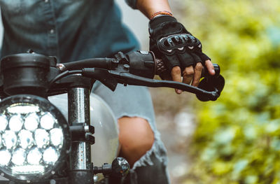 Woman sitting on motor bike