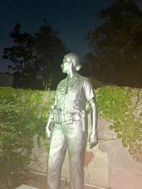 Statue of man and woman in park