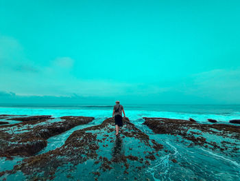 Scenic view of sea against blue sky