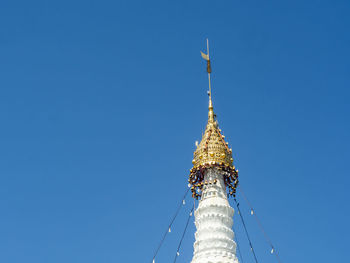 Low angle view of communications tower against sky