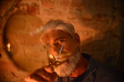 Portrait of a man holding wine glass