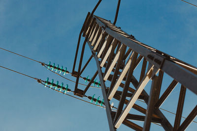 Low angle view of metallic structure against sky