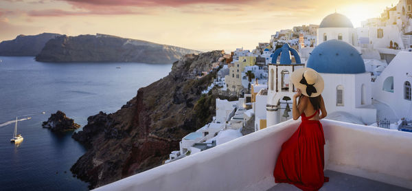 Panoramic view of sea and buildings against sky