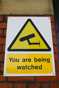 Close-up of warning sign on wall