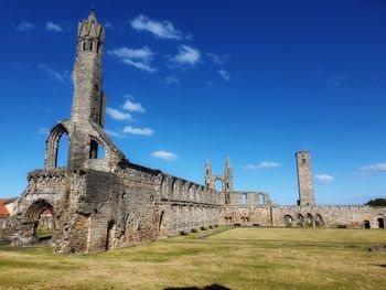 Low angle view of old ruin building against sky