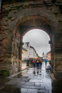 People walking in front of historical building