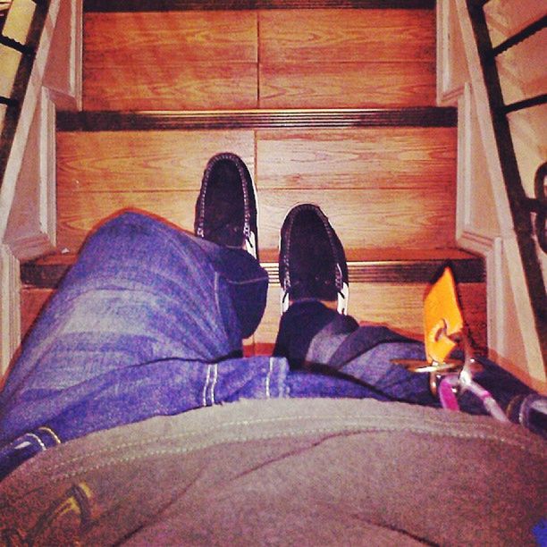 low section, shoe, person, lifestyles, jeans, men, leisure activity, standing, casual clothing, personal perspective, footwear, sitting, human foot, relaxation, high angle view, indoors