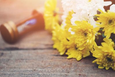 Close-up of yellow flower on table