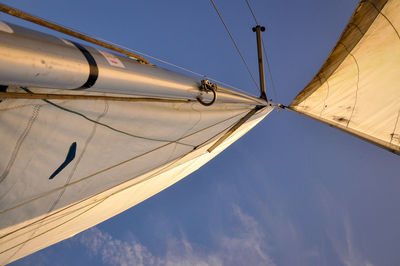 Low angle view of boat sailing against sky