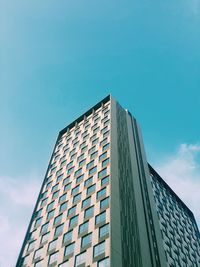Low angle view of office building against sky
