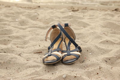 Close-up of toy on sand at beach