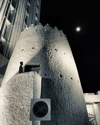 Low angle view of illuminated building at night