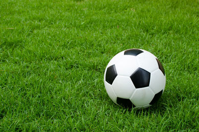 Close-up of soccer ball on field